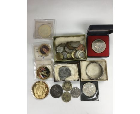 A silver napkin ring and a collection of modern commemorative coins plus a Georgian 1821 Crown.