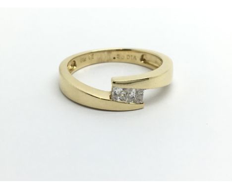 An 18ct gold two stone princess cut diamond ring, approx .20ct, approx 2.9g and approx size K- L.