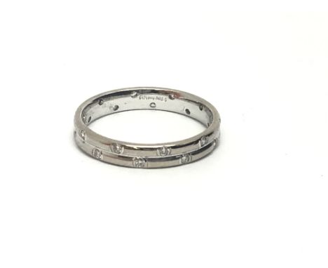 An 18ct white gold eternity ring set with twenty small diamonds, approx 2g and approx size H-I.