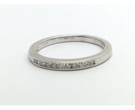 An 18ct white gold half eternity diamond ring, approx .11ct, approx 2.2g and approx size L.