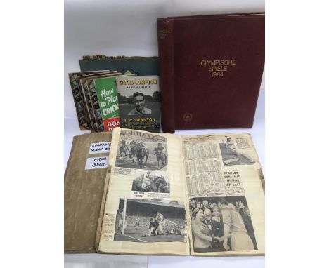 Two 1950s sporting scrapbooks, six vintage cricket manuals and a 1984 Olympics stamp collection in binder.