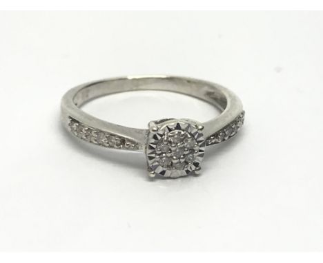 A 9ct white gold diamond cluster ring, approx 2g and approx size K- L.