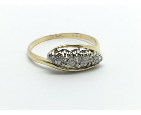 An 18carat gold ring circa 1930 set with a row of five diamonds. Ring size M.