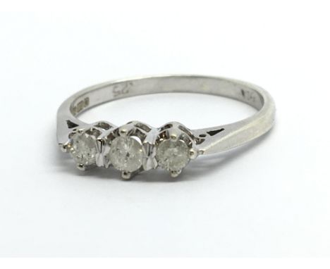 A 9ct white gold three stone diamond ring, approx.25ct, approx 1.7g and approx size K-L.