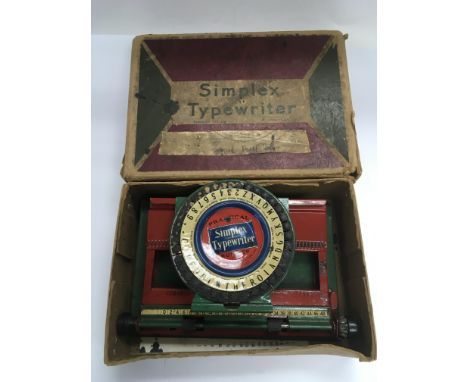 A boxed vintage miniature Simplex typewriter.