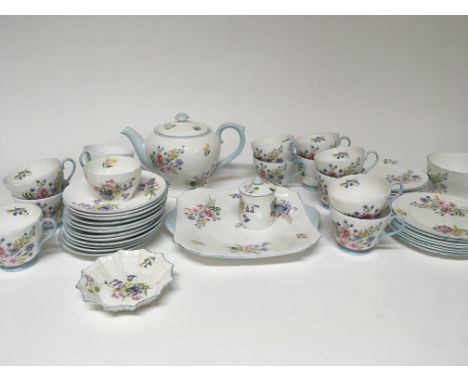 A Shelley Porcelain tea set the wild flowers pattern number 13668 comprising thirteen cups twelve saucers two sets of six sid