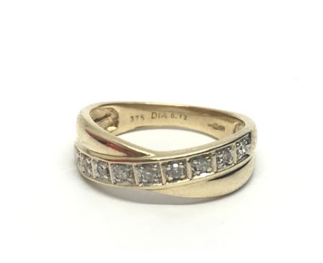 A 9ct gold half eternity twist ring, approx .12ct, approx 2.3g and approx size K-L.