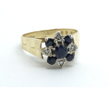 An 18ct gold sapphire and diamond ring in the form of a flowerhead, approx 4.6g and approx size O.