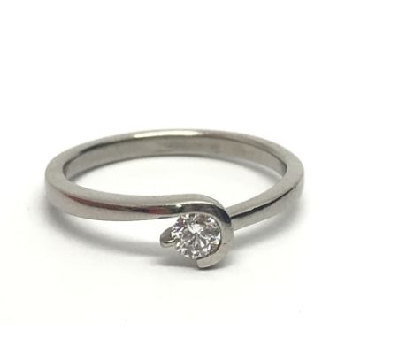 An unmarked white gold solitaire diamond ring, approx 1/4ct, approx 2.5g and approx size O-P.