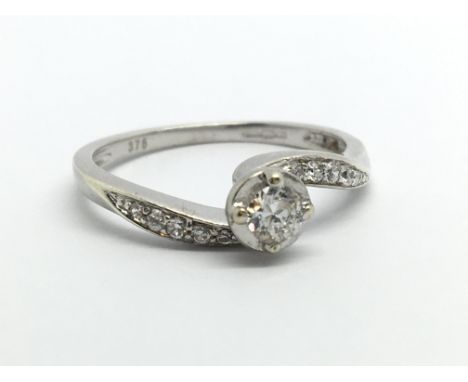 A 9ct white gold ten point solitaire diamond ring, approx 1.8g and approx size L.