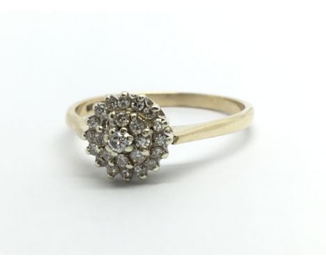 A 9ct gold diamond cluster ring, approx.25ct, approx 1.8g and approx size M-N.