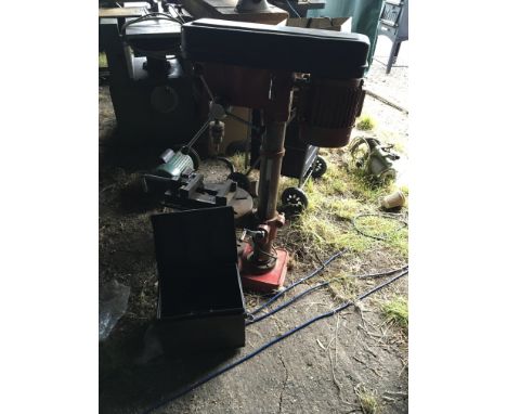 A Sealey pillar drill single phase seen working with a tin of mixed drills.