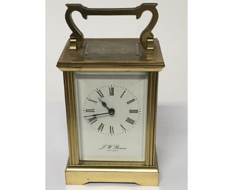 A brass cased carriage clock JW Benson London seen working and with key.