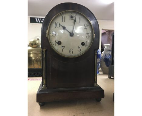 A small mahogany mantle clock by Waterbury clock co. USA - NO RESERVE