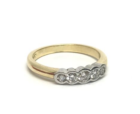 An 18ct gold five stone diamond ring, approx 4.2g and approx size O.