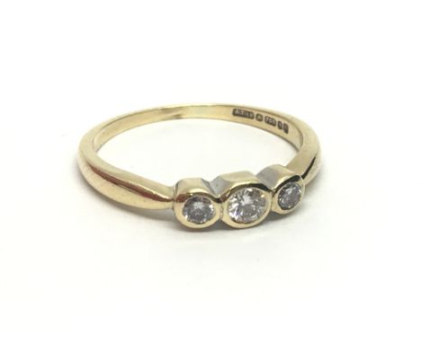 An 18ct gold three stone diamond ring, approx.20ct, approx 2.3g nd approx size K-L.