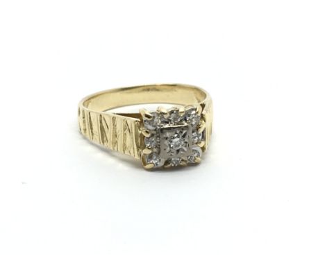 An 18carat gold ring set with a square pattern of diamonds. Approximately 0.20 of a carat Ring size N.