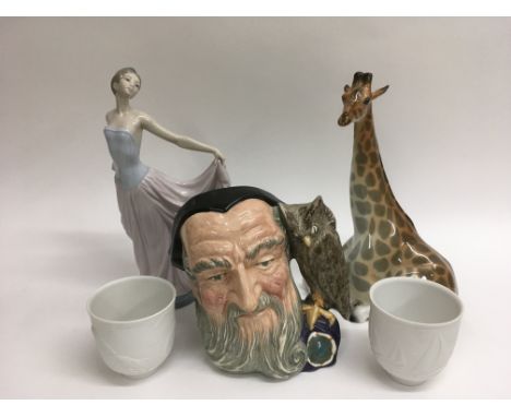 A Lladro figure of a girl, Royal Doulton 'Merlin' character jug, a Lomonosov figure of a giraffe and a pair of Lladro collect
