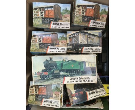 Two boxes of vintage trains, track and accessories including unmade Airfix kits.
