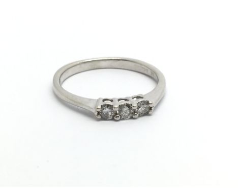 A 9ct white gold three stone diamond ring, approx.12ct, approx 2.4g and approx size N.