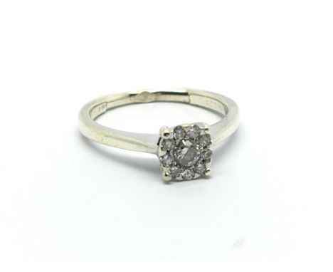 A 9carat gold ring set with a pattern of diamonds ring size L.