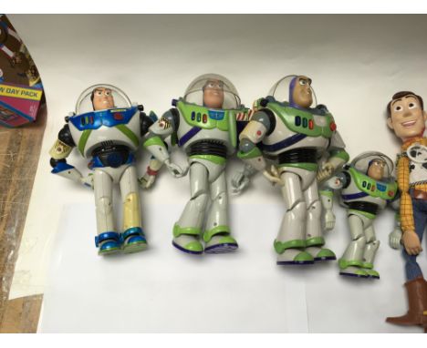 Included is a large assortment of toys including buzz light year, woody and Denis the menis.