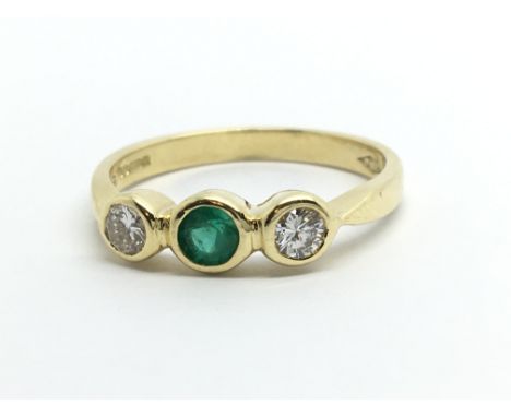 An 18ct gold emerald and diamond ring, approx .30ct, approx 3g and approx size L-M.