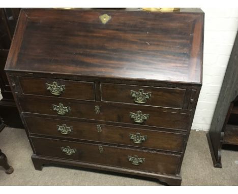 A Georgian mahogany bureau the fall front above two short and three long drawers on bracket feet - NO RESERVE