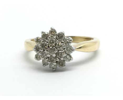 An 18ct gold diamond cluster ring, approx 1/2ct, approx 3.8g and approx size J-K.