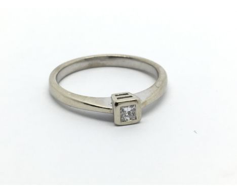 A 9carat white gold ring set with a solitaire diamond. ring size K-L