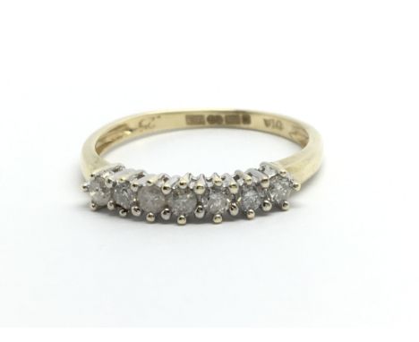 A 9ct gold seven stone diamond ring, approx.25ct, approx 1.4g and approx size L.