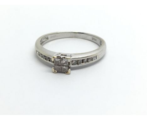 A 9ct white gold fourteen stone diamond ring, approx .20ct, approx 1.5g and approx size J-K.