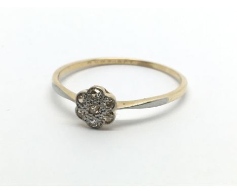 An 18carat gold ring set with a small pattern of chip stone diamonds ring size Q