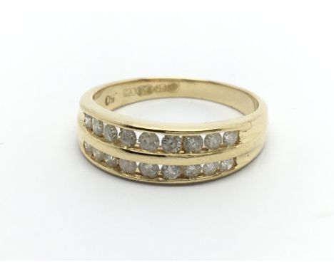 An 18carat gold ring set with two rows of brilliant cut diamonds ring size N.