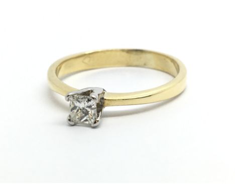 An 18ct gold solitaire diamond ring set with a single princess cut diamond, approx.33ct, approx 2.4g and approx size M.