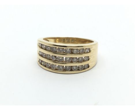 An 18carat gold ring set with three rows of brilliant cut diamonds. ring size K.