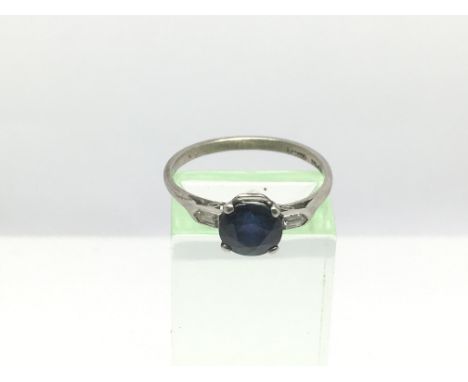 A sapphire and diamond ring, approx 3g and approx size S.