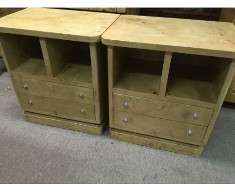 A pair of maple side cabinets the two open sections above two drawers on a plinth base .