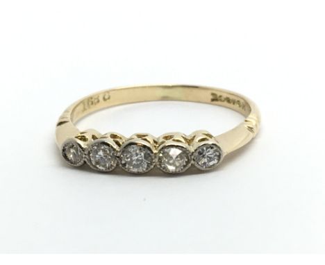 An 18ct gold five stone diamond ring, approx .25ct, approx 1.8g and approx size K.