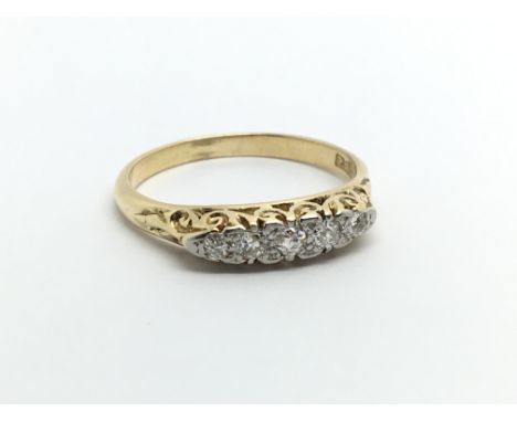 An 18carat gold ring set with a row of five diamonds. Ring size N.