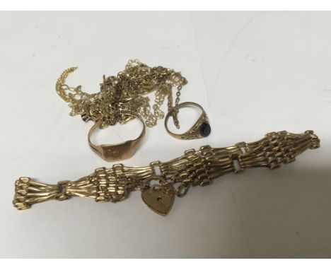 A collection of 9carat gold jewellery including a gate bracelet rings and necklaces. Weight 13g approximately.