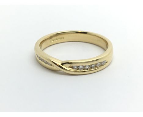 An 18ct gold 12 stone half eternity ring, approx .15ct, approx 4g and approx size O.