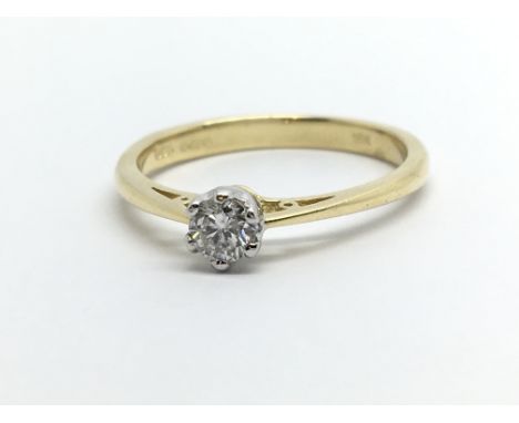 An 18ct gold solitaire diamond ring, approx.25ct, approx 2.6g and approx size N.