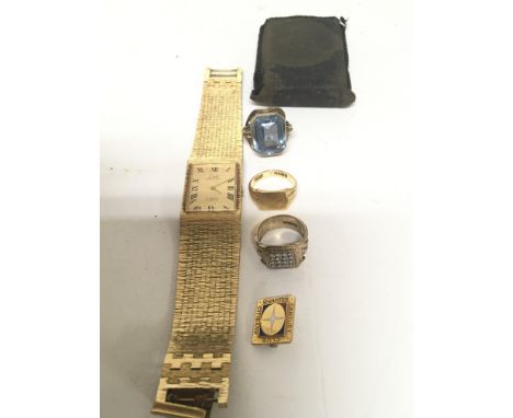 An 18carat gold gents ring 6g approx one other gold ring set with a pave of white stones a gold plated watch a ring set with 