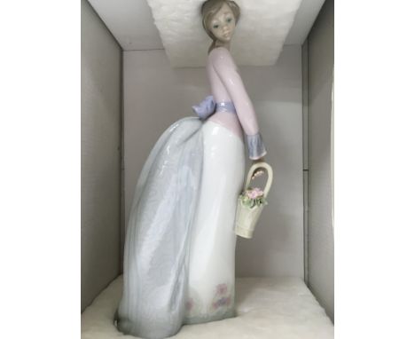Two Lladro figures basket of love and tall yarrin.