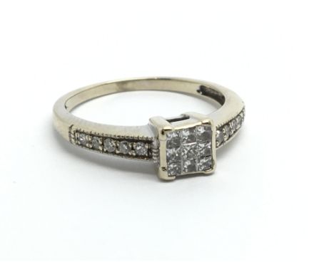 An 18ct white gold cluster ring set with princess cut diamonds, approx .33ct, approx 3.5g and approx size O-P.