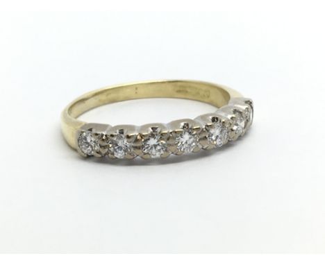 An 18ct gold seven stone diamond ring, approx .45ct, approx 2.4g and approx size K-L.