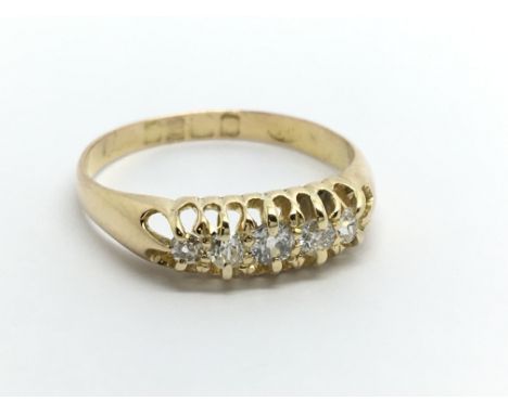 A Vintage 18carat gold ring set with a row of five diamonds ring size N.