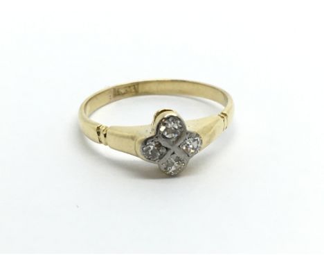 A small 18carat gold ring set with four small diamonds. Ring size F.