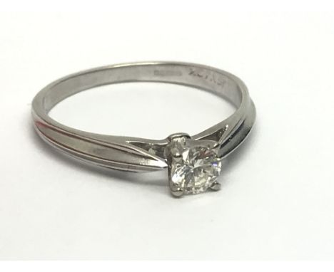 A 9ct white gold solitaire diamond ring, approx 1/4ct, approx 1.7g and approx size L.